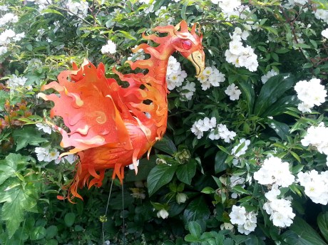 This is the phoenix in my garden. The artist made it out of an old pink flamingo. This is a good kind of orange, the orange of transformation.